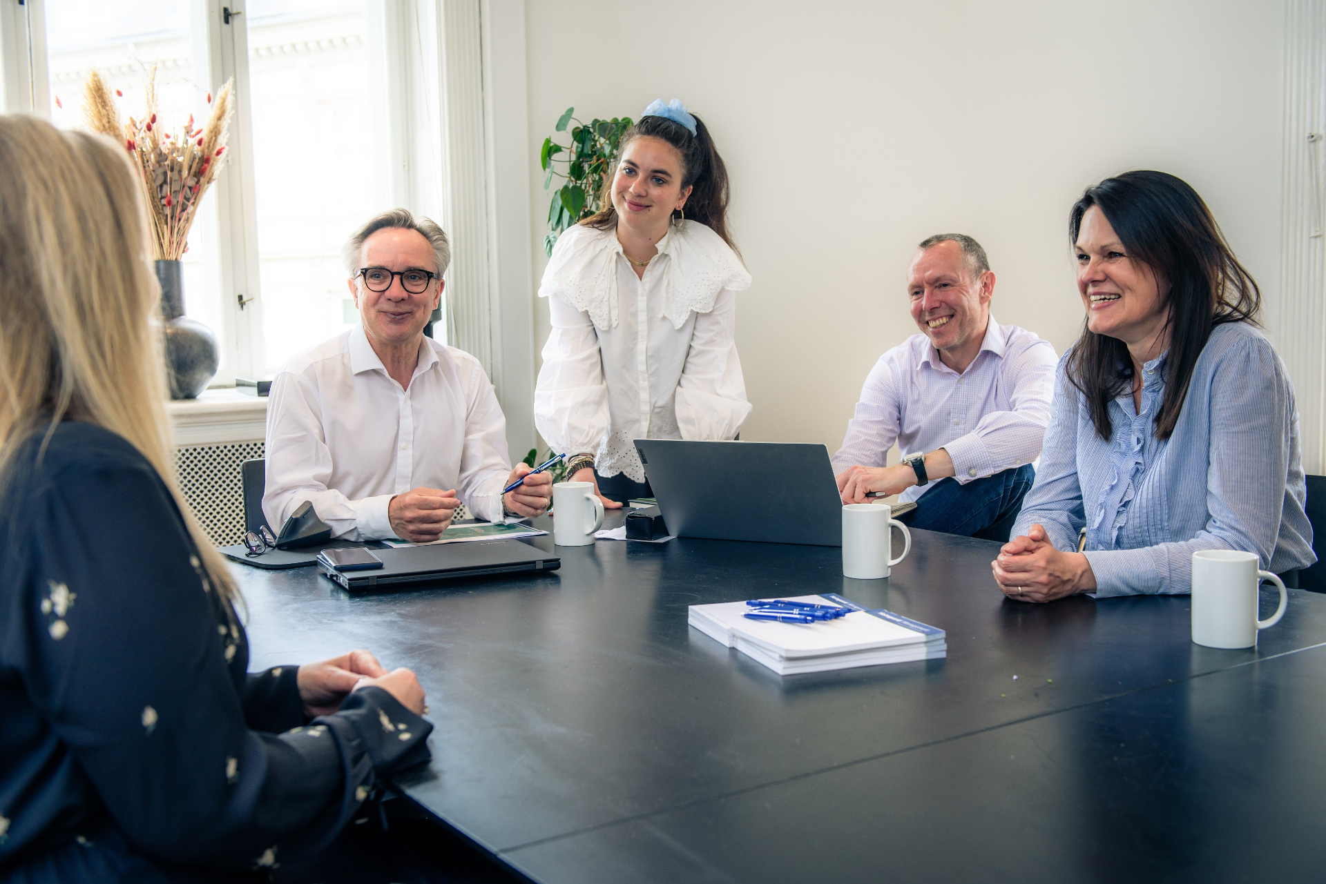Professional business meeting with executive leaders discussing strategy
